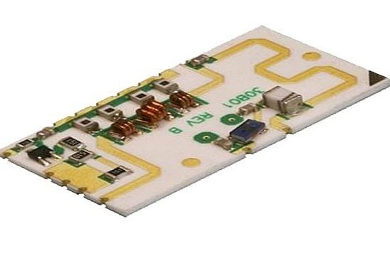 Assembled white ceramic circuit carrying components and gold-colored tracks