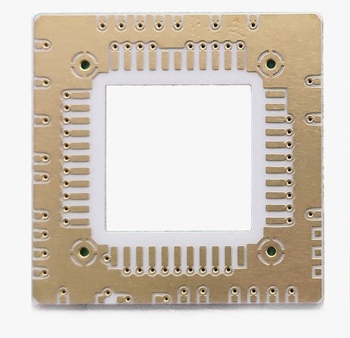Square ceramic package carrier with a central cavity and peripheral pads