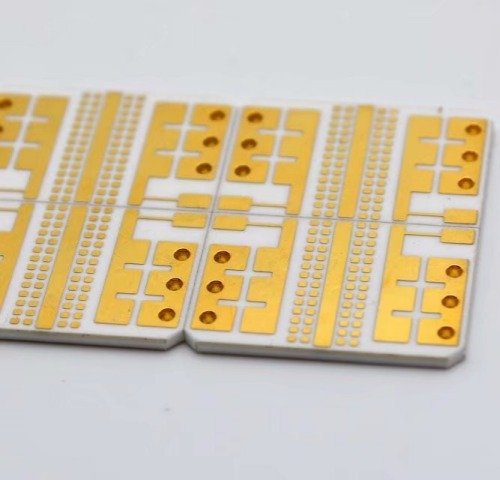 Ceramic circuit panels with gold-colored bond pads and through-holes