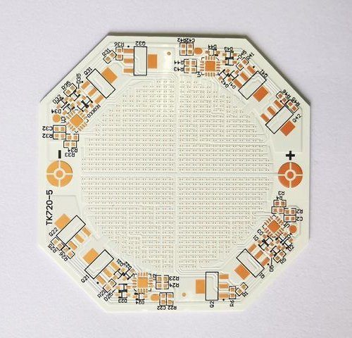 Octagonal ceramic circuit with repeated small pads and labeled component positions