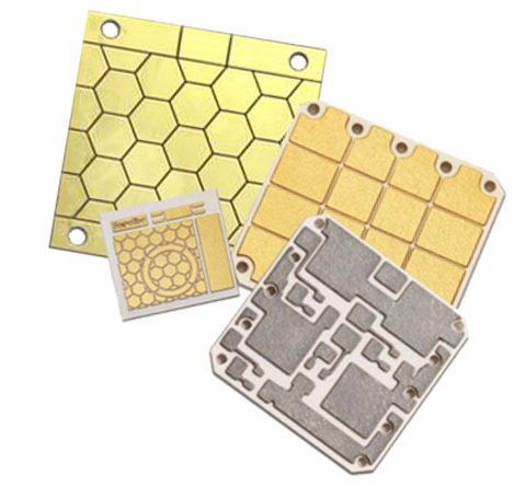 Four ceramic circuit carriers with patterned gold-colored and silver-colored metallization