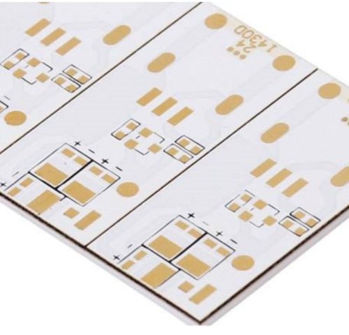 White ceramic circuit panel with repeated gold-colored contact patterns